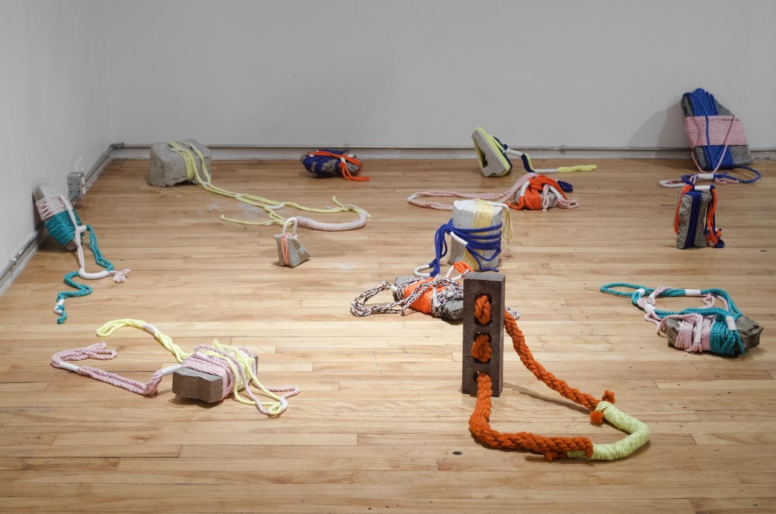 A group of toy figurines on a wood floorDescription automatically generated with low confidence
