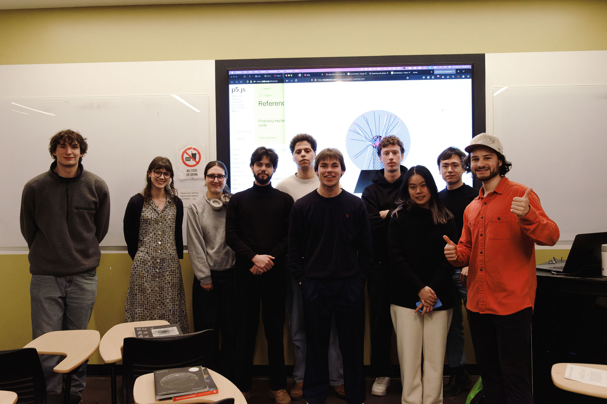 Group photo of workshop participants with David Holcer in front of the screen