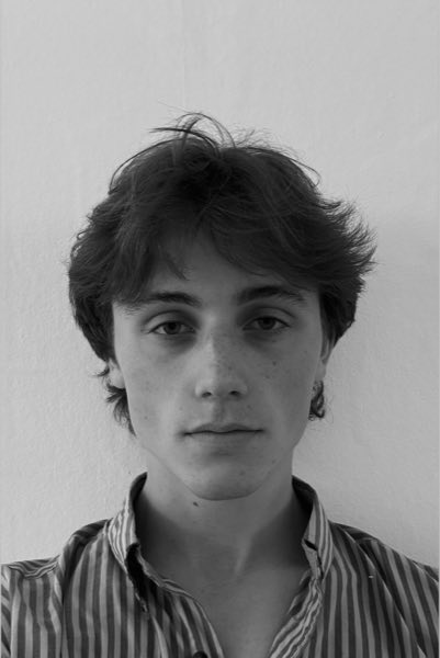 Black-and-white portrait of Elias Doering in a striped shirt, facing the camera